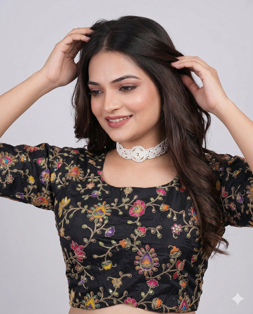 Black embroidered saree blouse front view with pearl choker