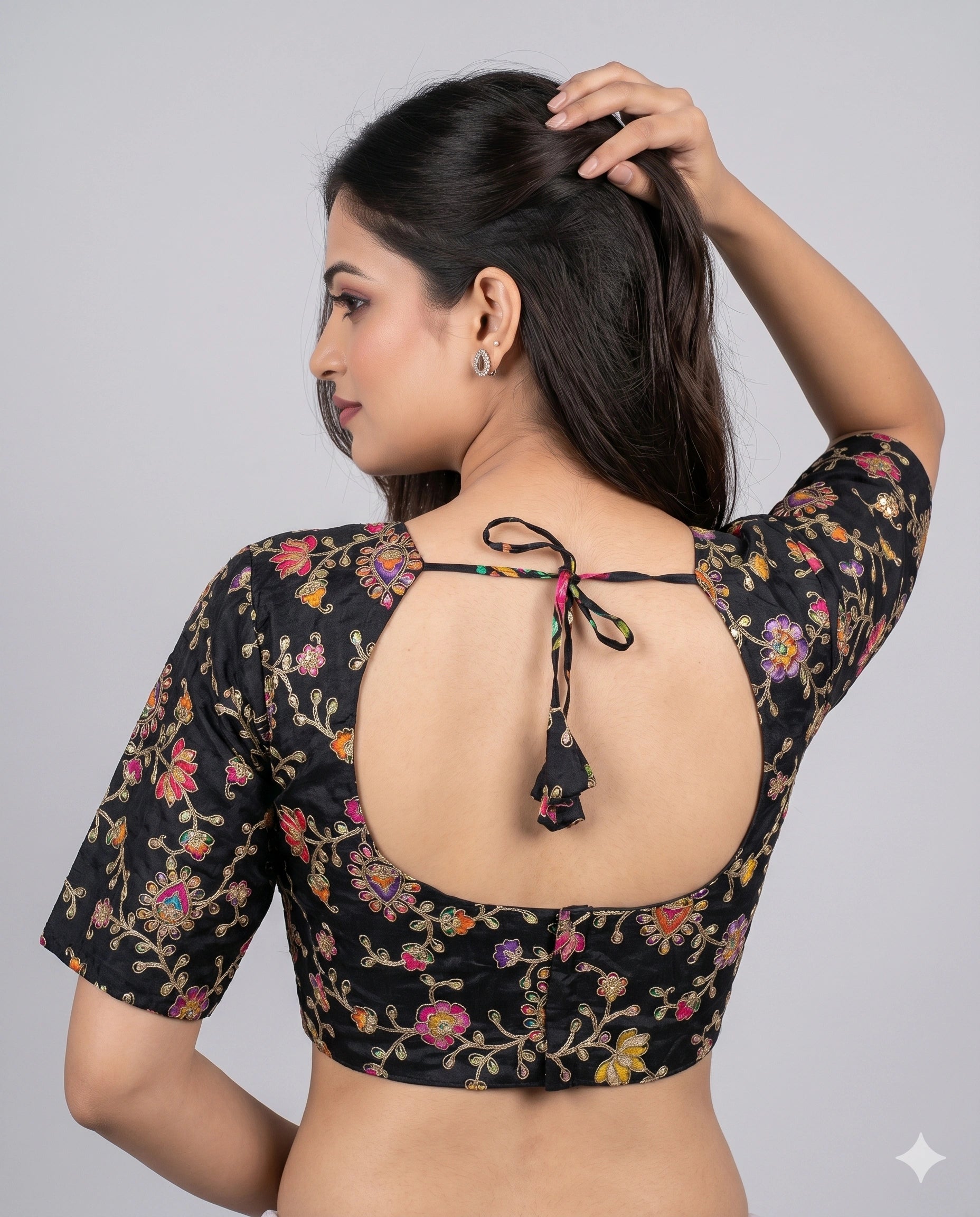 Black embroidered saree blouse front close-up view